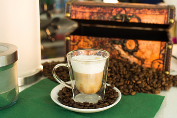 cup of coffee next to chest