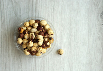 Healthy food  for background image close up hazelnuts.  Nuts texture on white grey table top view