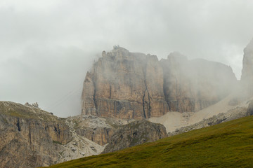 view of Dolomites mountains on a foggy day, South Tyrol