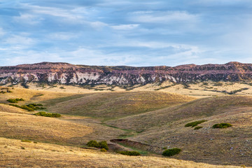 rolling prairie and cliff