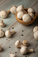 mushrooms on a light blue wooden surface