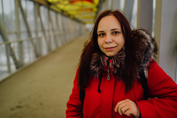 Beautiful girl on the bridge, looking into the distance