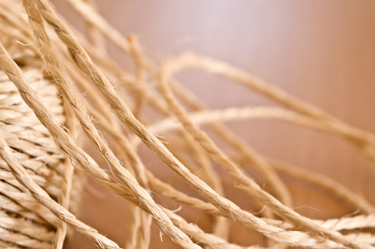 Tangled string on wooden table.