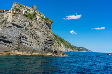 Italy, Cinque Terre, Vernazza, a large body of water with a mountain in the background