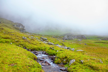 fog in the mountains, flowing water of little river