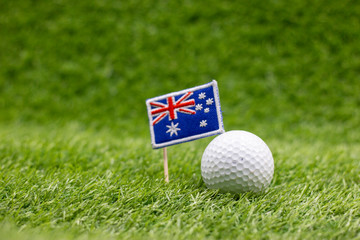 Golf ball with Australia Flag are on green grass