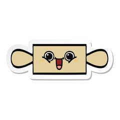sticker of a cute cartoon rolling pin