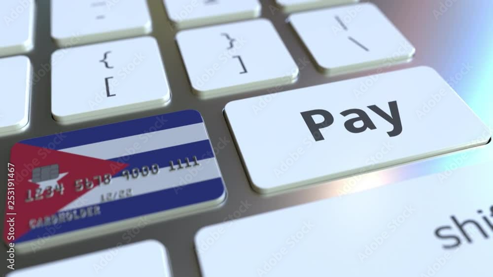 Poster bank card featuring flag of cuba as a key on a computer keyboard. cuban online payment conceptual an