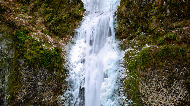 Icy Blue Frozen Waterfall In Oregon USA