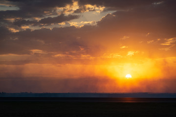 Smoke haze being illuminated by an orange sunset, Victoria Australia