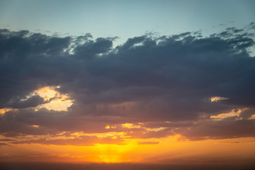 Fototapeta na wymiar A sunset lit bank of clouds over a field in Victoria Australia