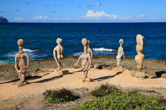 Stone sculpture of a woman and man in Can Picafort Majorca, Mallorca, Spain.