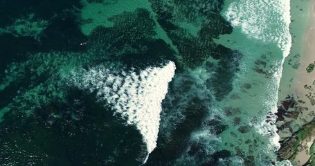 Top down abstract aerial view of ocean waves crashing on shoreline - Powered by Adobe