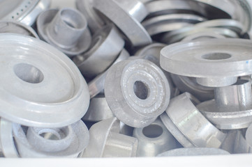 Gas plates spare parts for cooker, product shopping display background. Closeup on golden and gray shiny round shape elements of household appliance.