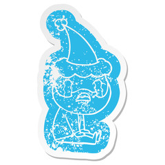 cartoon distressed sticker of a bearded man crying wearing santa hat