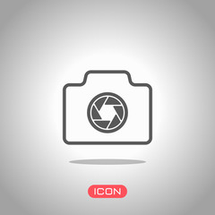 Photo camera, linear symbol with thin outline, simple icon. Icon under spotlight. Gray background