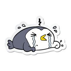 sticker of a cartoon crying penguin