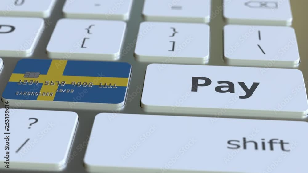 Poster bank card featuring flag of sweden as a key on a computer keyboard. swedish online payment conceptua