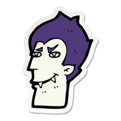 sticker of a cartoon vampire face
