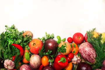 Healthy clean eating layout, vegetarian food and diet nutrition concept. Various fresh vegetables ingredients for cooking on white table background, copy space, top view