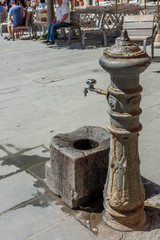 Obraz na płótnie Canvas Italy, Cinque Terre, Vernazza, a fountain in the middle of a sidewalk