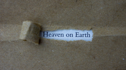 Torn paper with text heaven on earth