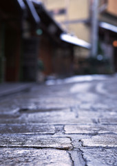 a stone and cement pathway with the background blurred