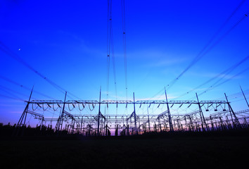 In the evening, the silhouette of high voltage towers