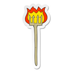 sticker of a cartoon flaming devil fork