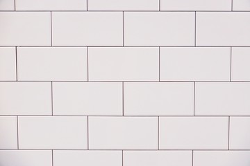 close up white vintage ceramic brick tile wall