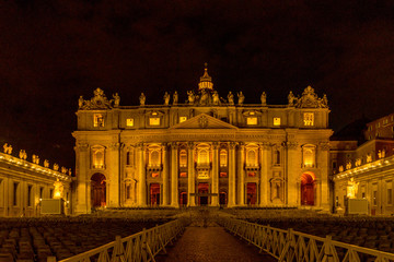 Naklejka premium Vatican City,Italy - 23 June 2018: St.Peters Basilica is illuminated with lights at night in Vatican city in the square at night