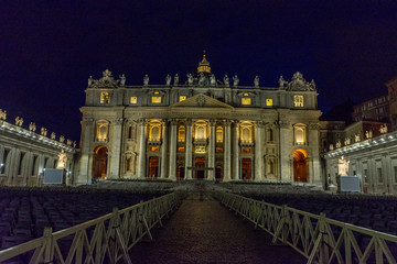 Fototapeta premium Vatican City,Italy - 23 June 2018: St.Peters Basilica is illuminated with lights at night in Vatican city in the square at night