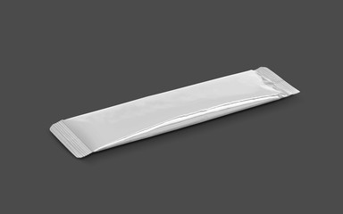 blank packaging aluminum foil instant coffee stick sachet isolated on gray background