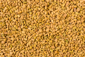 fenugreek seeds background. Natural seasoning texture. Natural spices and food ingredients.