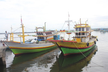 Fototapeta premium FISHING BOATS IN MAYANGAN PORT, PROBOLINGGO, EAST JAVA, INDONESIA