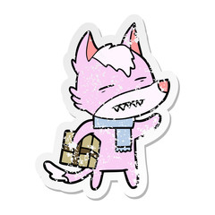 distressed sticker of a cartoon wolf with a gift