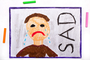 Colorful drawing: Crying sad man and word SAD