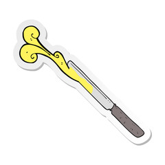 sticker of a cartoon butter knife