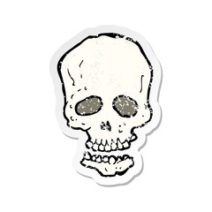 retro distressed sticker of a cartoon skull