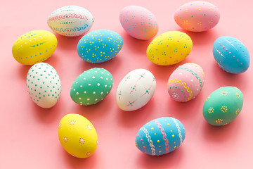 Colorful Easter eggs background on pink background