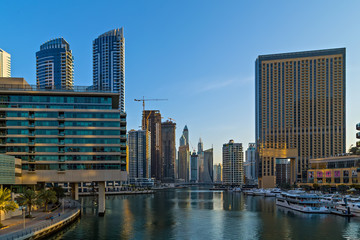 Dubai marina towers, boats and skyscrapers