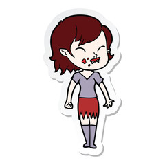 sticker of a cartoon vampire girl with blood on cheek