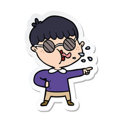 sticker of a cartoon boy wearing spectacles and pointing