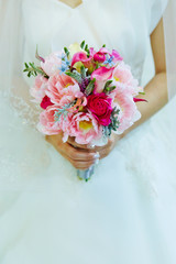 bride holding wedding bouquet