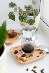 Hot coffee dripping in Vietnam style, minimal concept, day light