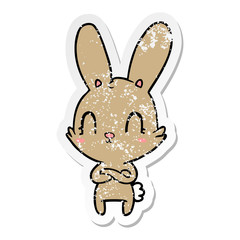 distressed sticker of a cute cartoon rabbit