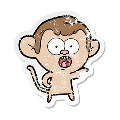 distressed sticker of a cartoon shocked monkey