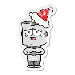 distressed sticker cartoon of a robot wearing santa hat