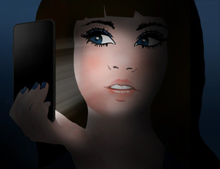 A teen girl looks at her cell phone that is emitting the light that illuminates her face.