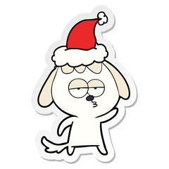 sticker cartoon of a bored dog wearing santa hat